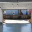 A clean garage with the door open