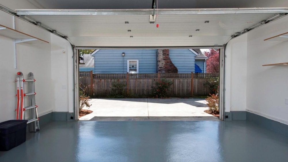 A clean garage with the door open