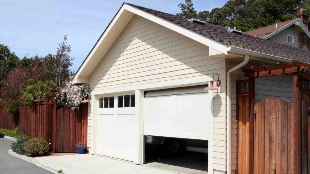 A residential garage door is opening.