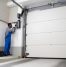 A professional is installing an automatic garage door.