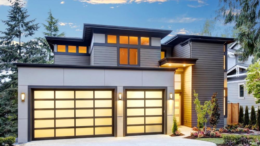 Two automatic garage doors at the entrance of a beautiful house.
